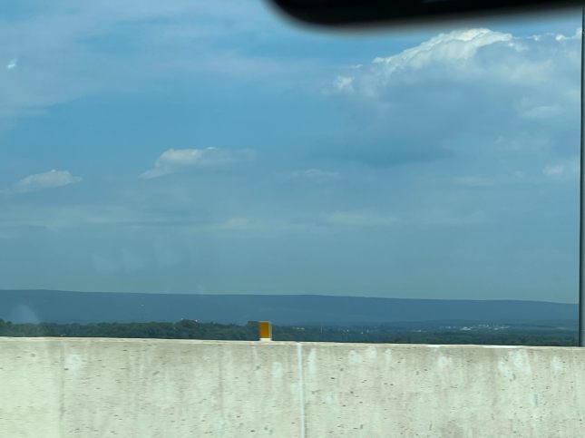A bridge with mountains in the distance